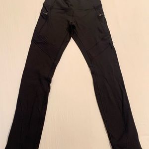 Lululemon fleece lined leggings with zipper details at the ankle.